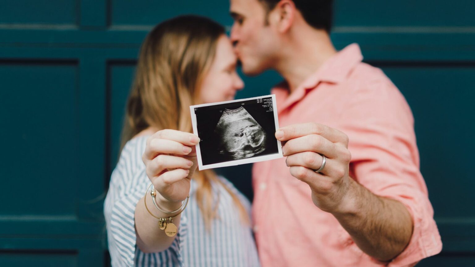 Two People Holding An Ultrasound