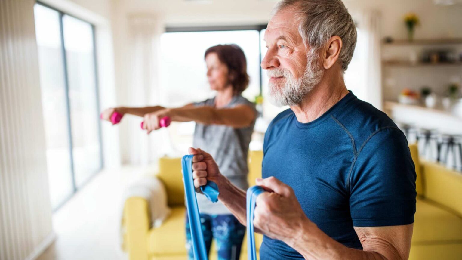 Man And Woman Exercising At Home