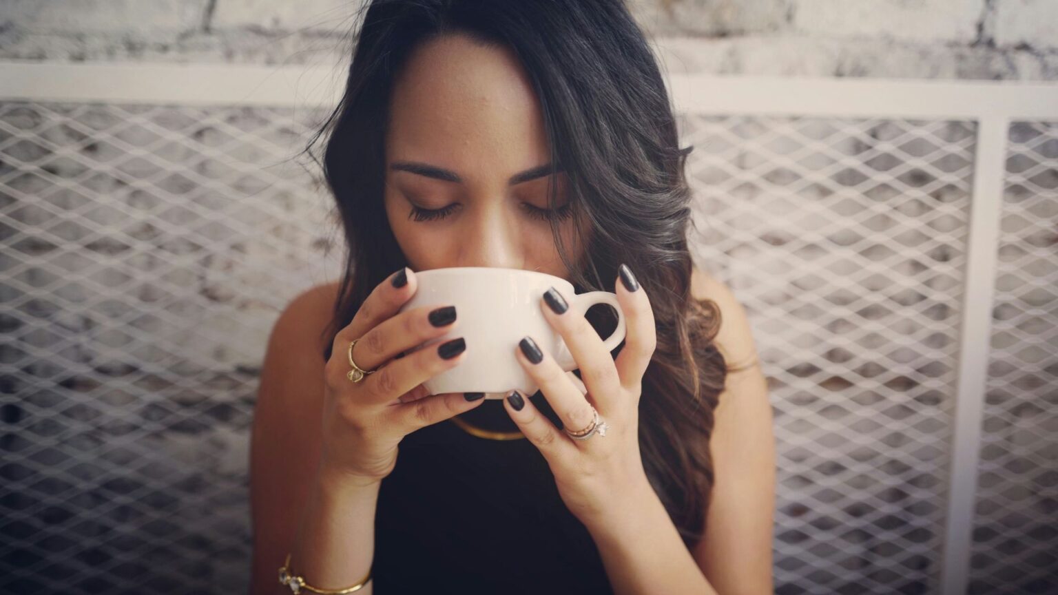 Woman Drinking From White Coffee Cup