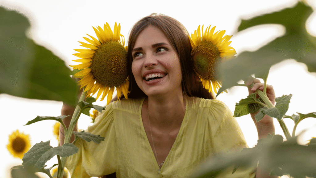 Woman Smiling In Sunflower Patch