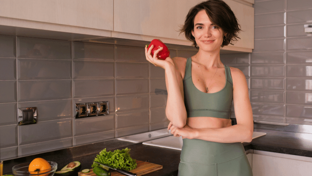 Woman In Kitchen In Exercise Clothes