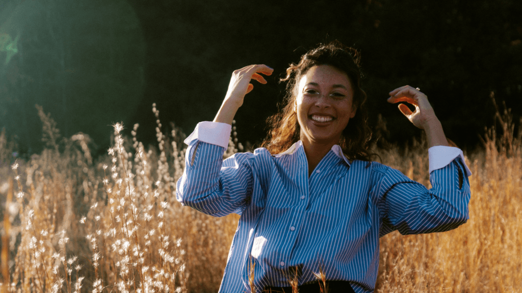 Woman Laughing In Field