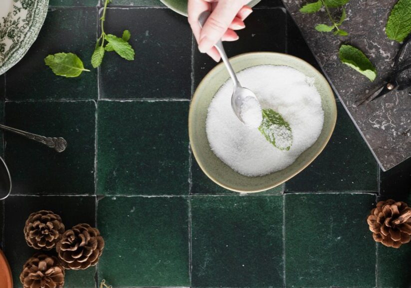 Bowl Of Sugar And Mint With A Spoon In It